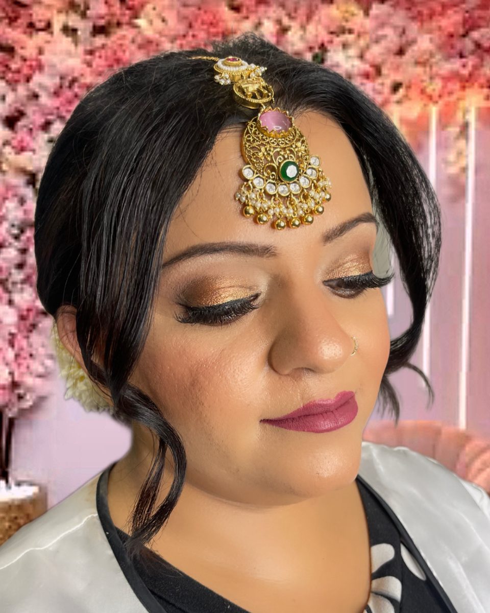 Glam makeup with statement jewellery